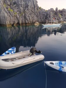 Maria’s tender and kayaks resting on calm water, ready for guests in El Nido